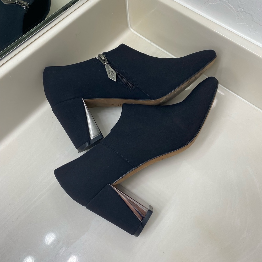 Black low booties with silver heel detail